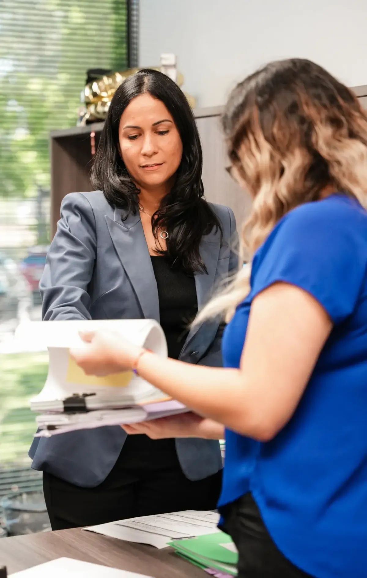 Legal team members reviewing documents in the office